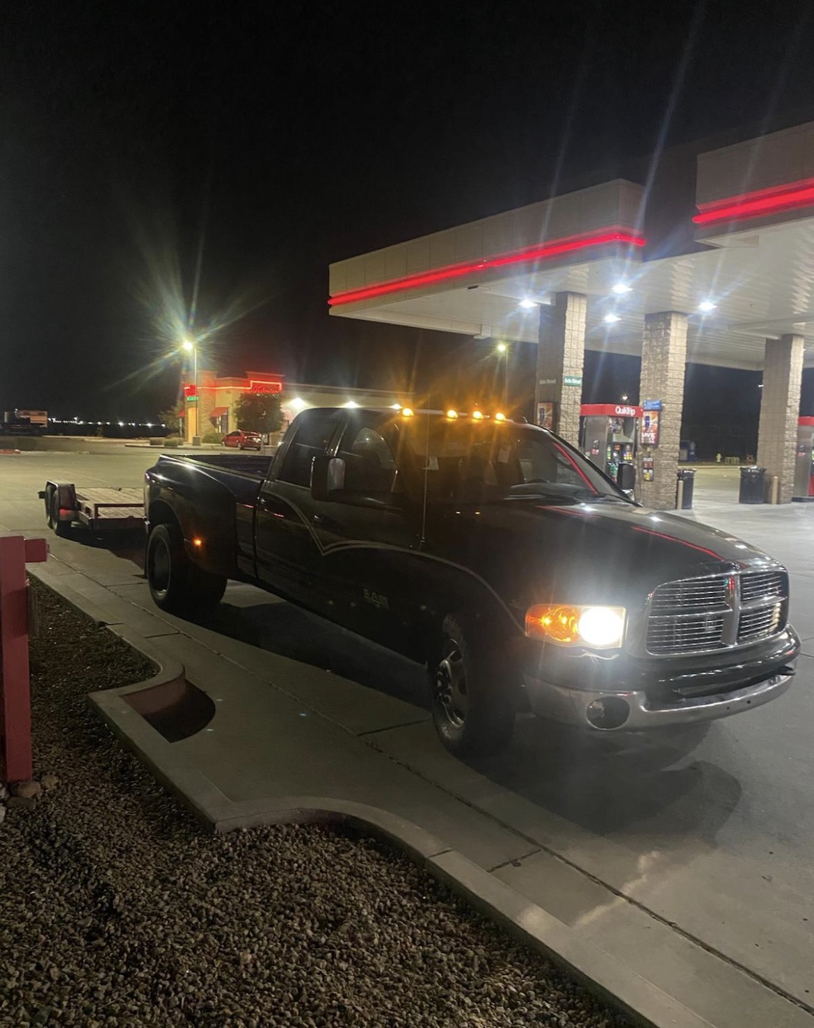 JT & Sons towing truck at night